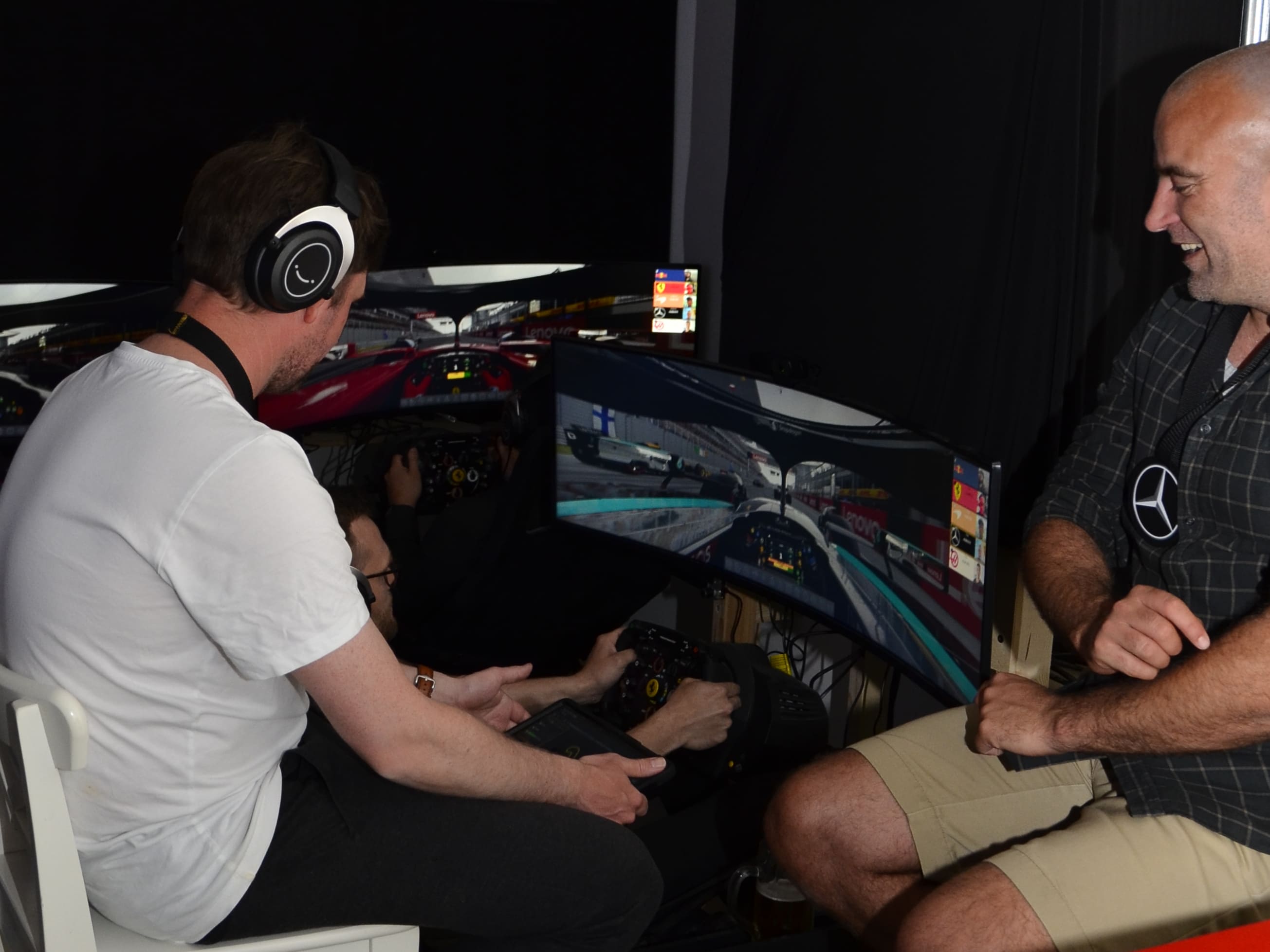Professional racing simulator setup with ultra-wide screens